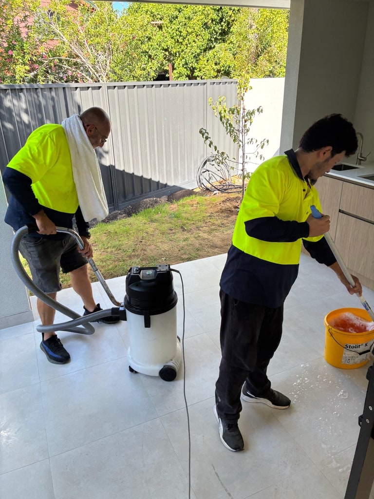 WOCS cleaners working on floor cleaning inside a property