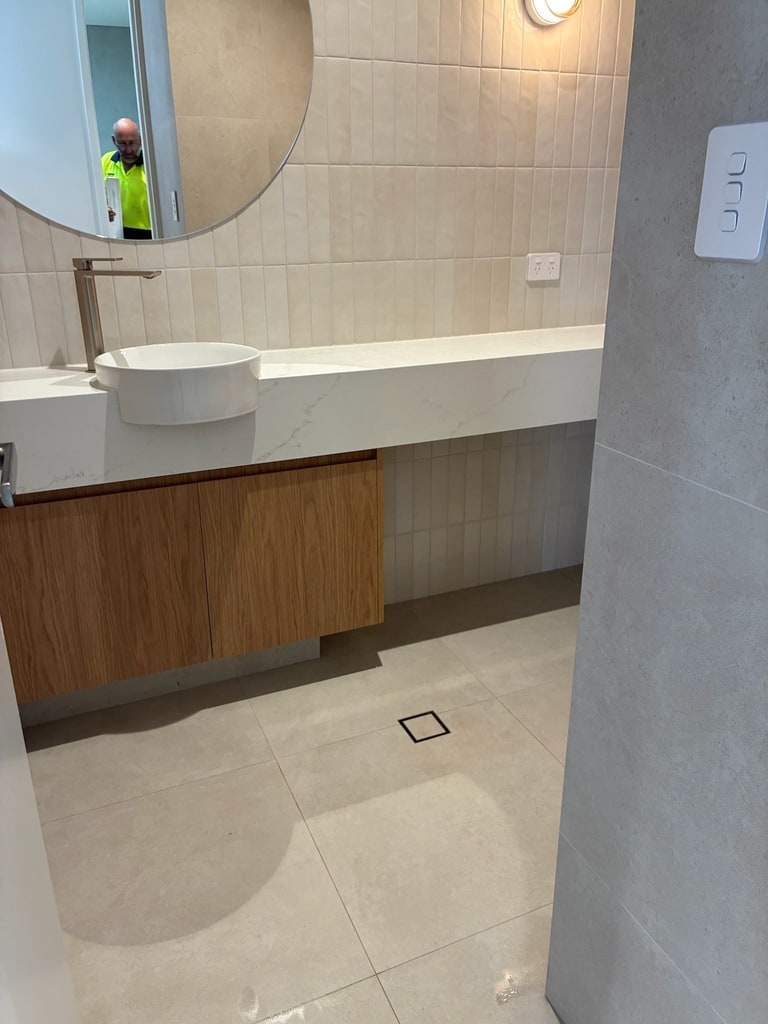 Clean bathroom vanity and floor after detailed cleaning